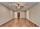 Finished basement featuring wood-look floors, drop ceiling and access to stairs at 5195 Stefan Ridge Way, Buford, GA 30519