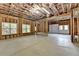 Unfinished basement with windows, studs, and concrete floor at 5195 Stefan Ridge Way, Buford, GA 30519