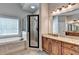 Bathroom features a shower, soaking tub, and a double vanity at 5195 Stefan Ridge Way, Buford, GA 30519