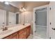 Bathroom vanity with double sinks with a connecting door to a bedroom at 5195 Stefan Ridge Way, Buford, GA 30519
