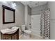 Bathroom with a shower-tub and a wood vanity sink at 5195 Stefan Ridge Way, Buford, GA 30519