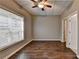 Bedroom featuring a window and hardwood floors at 5195 Stefan Ridge Way, Buford, GA 30519