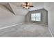 Spacious bedroom with vaulted ceilings, carpeted floors, a large window, and ceiling fan at 5195 Stefan Ridge Way, Buford, GA 30519