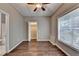 Bedroom featuring wood look floors, closet, drop ceiling and neutral colored paint at 5195 Stefan Ridge Way, Buford, GA 30519