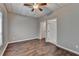 Bright bedroom with wood-look floors and a ceiling fan at 5195 Stefan Ridge Way, Buford, GA 30519