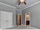 Spacious bedroom featuring a closet and doorway leading to bathroom at 5195 Stefan Ridge Way, Buford, GA 30519