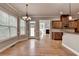 Open dining area with hardwood floors and access to the kitchen at 5195 Stefan Ridge Way, Buford, GA 30519
