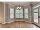 Bright dining area with hardwood floors and a patio door at 5195 Stefan Ridge Way, Buford, GA 30519