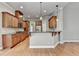 Beautiful kitchen with wood cabinets, granite countertops, and stainless steel appliances at 5195 Stefan Ridge Way, Buford, GA 30519