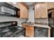 Kitchen featuring appliances, granite countertops and light wooden cabinets at 5195 Stefan Ridge Way, Buford, GA 30519