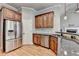 Kitchen with stainless steel appliances, granite countertops and wooden cabinets at 5195 Stefan Ridge Way, Buford, GA 30519
