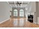 Bright living room with hardwood floors and a fireplace at 5195 Stefan Ridge Way, Buford, GA 30519