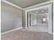 Open living room with a coffered ceiling, and trim details at 5195 Stefan Ridge Way, Buford, GA 30519