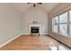 Spacious living room features a vaulted ceiling, hardwood floors, and stone fireplace at 5195 Stefan Ridge Way, Buford, GA 30519