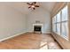 Large living room featuring vaulted ceiling, hardwood floors, and a stone fireplace at 5195 Stefan Ridge Way, Buford, GA 30519