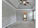 Well-lit main bedroom boasts a tray ceiling, ceiling fan, and neutral color scheme at 5195 Stefan Ridge Way, Buford, GA 30519