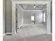 Large main bedroom with trey ceilings, decorative pillars, and neutral colors at 5195 Stefan Ridge Way, Buford, GA 30519