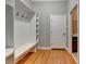 Mudroom featuring a bench, hooks, and built-in shelving for ample storage at 5195 Stefan Ridge Way, Buford, GA 30519