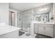 Modern bathroom with a glass shower, dual sinks, and granite countertops at 1702 Prospect Way, Conyers, GA 30094