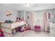 bedroom featuring pink accents, a bunkbed, and neutral paint at 1702 Prospect Way, Conyers, GA 30094