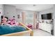 bedroom featuring pink accents, a bunkbed, and a TV at 1702 Prospect Way, Conyers, GA 30094