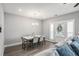 Inviting dining area features a stylish table, comfortable seating, modern lighting, and plenty of space at 1702 Prospect Way, Conyers, GA 30094