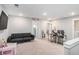 Open-concept living area featuring lots of space and a comfortable sofa at 1702 Prospect Way, Conyers, GA 30094