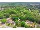 Scenic aerial view of a home nestled among a canopy of trees in a serene neighborhood at 22 Oakwood Hills Dr, Suwanee, GA 30024