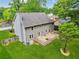 The expansive backyard features a well-maintained lawn, a wooden deck, and gray siding, making it ideal for relaxation at 22 Oakwood Hills Dr, Suwanee, GA 30024
