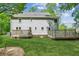 Exterior view of home with a spacious backyard and two-level deck for outdoor enjoyment at 22 Oakwood Hills Dr, Suwanee, GA 30024