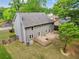 The expansive backyard features a well-maintained lawn, a wooden deck, and gray siding, making it ideal for relaxation at 22 Oakwood Hills Dr, Suwanee, GA 30024