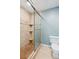 Bathroom featuring a tiled shower with glass door and a white toilet at 22 Oakwood Hills Dr, Suwanee, GA 30024