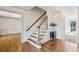 Open foyer showcasing hardwood floors, staircase, and entryways to living spaces at 22 Oakwood Hills Dr, Suwanee, GA 30024