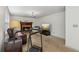 Comfortable living space with a brick fireplace, neutral carpet, and a fitness machine at 22 Oakwood Hills Dr, Suwanee, GA 30024