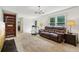 Bright living room with plush seating, a bookcase, and large windows for natural light at 22 Oakwood Hills Dr, Suwanee, GA 30024
