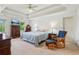 Spacious main bedroom with a trey ceiling, sitting area, and abundant natural light at 22 Oakwood Hills Dr, Suwanee, GA 30024