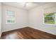 Bedroom with original hard wood floors, neutral walls, and updated windows at 3367 Misty Valley Rd, Decatur, GA 30032