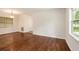 Open floor plan with hardwood floors and updated lighting fixture at 3367 Misty Valley Rd, Decatur, GA 30032