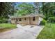 Charming single-story home features a brick exterior and mature trees at 3367 Misty Valley Rd, Decatur, GA 30032