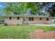 Cozy home with light brick exterior and well-maintained front yard at 3367 Misty Valley Rd, Decatur, GA 30032