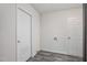 Mud room with gray vinyl flooring and two white doors at 3367 Misty Valley Rd, Decatur, GA 30032