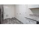 Cozy mud room with gray toned floors, and easy access to the laundry room and backyard at 3367 Misty Valley Rd, Decatur, GA 30032