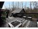 Outdoor deck with furniture, firepit, grill and view of backyard and detached structure at 3404 Vinings North Se Trl, Smyrna, GA 30080