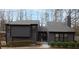 Charming two-story home with a grey exterior, well-maintained landscaping, and inviting front entrance at 3404 Vinings North Se Trl, Smyrna, GA 30080