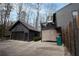 Exterior showcasing the detached garage, balcony and private fenced yard at 3404 Vinings North Se Trl, Smyrna, GA 30080
