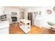 Bright kitchen features stainless steel appliances, subway tile backsplash, island and lots of cabinet space at 3404 Vinings North Se Trl, Smyrna, GA 30080