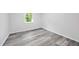 Cozy bedroom features modern flooring and a bright window at 6801 Red Maple Dr, Rex, GA 30273