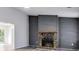 Spacious living room with a stone fireplace and modern flooring at 6801 Red Maple Dr, Rex, GA 30273