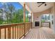 Covered deck includes outdoor fireplace and private backyard views at 8230 Dawson View Way, Cumming, GA 30028