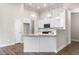 Bright kitchen with stainless appliances, granite counters, and ample storage at 8230 Dawson View Way, Cumming, GA 30028